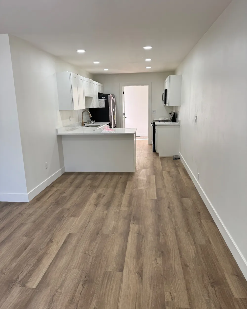 Finished interior with new recessed lighting and kitchen electrical